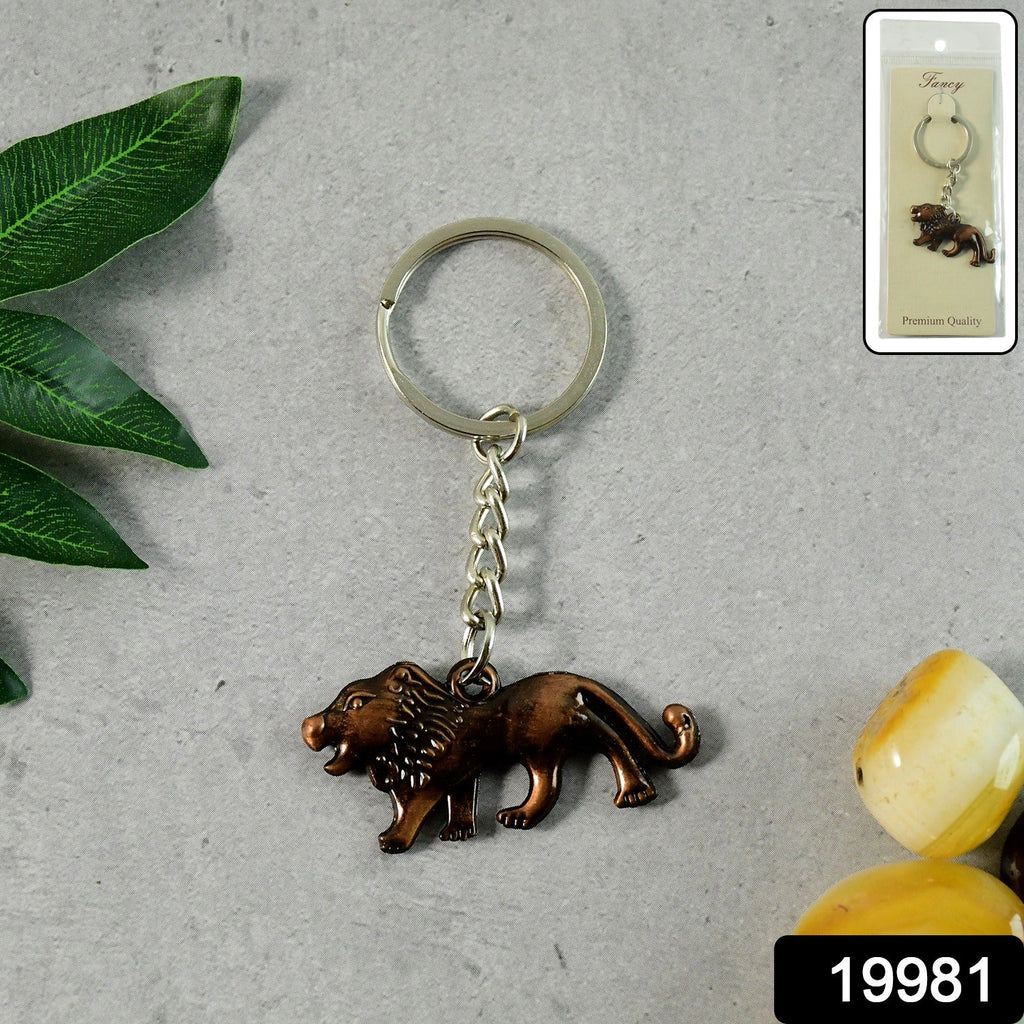 Close-up of the intricate walking lion design on metal keychain