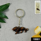 Close-up of the intricate walking lion design on metal keychain