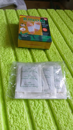 Display of Kinoki Detox Foot Pads with key natural ingredients like ginger and salt.