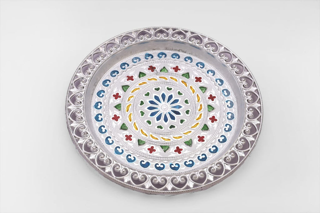 Decorative silver plated pooja thali with a polished finish, reflecting cultural heritage.