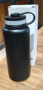 Compact black vacuum insulated stainless steel water bottle