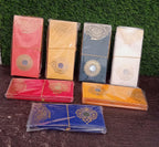 Group of glossy premium designer wedding envelopes displayed together.