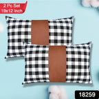 Close-up of a stylish leather and cotton cushion cover with intricate texture.