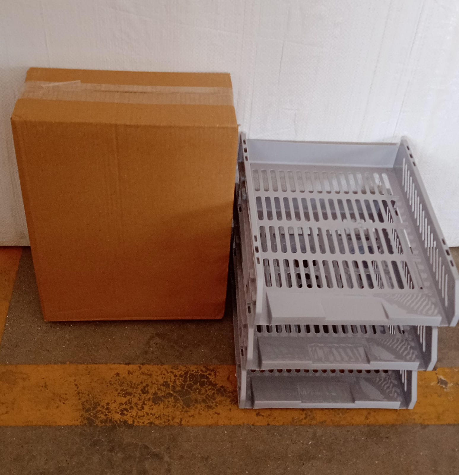 Elegant multi-layer office file rack on a counter, enhancing workspace.