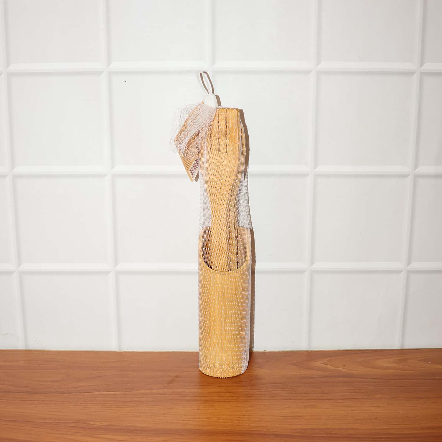 Natural bamboo cooking spatula set styled on kitchen counter