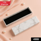 Closed marble finish rigid cardboard jewelry gift box, 21x5cm, with velvet insert.