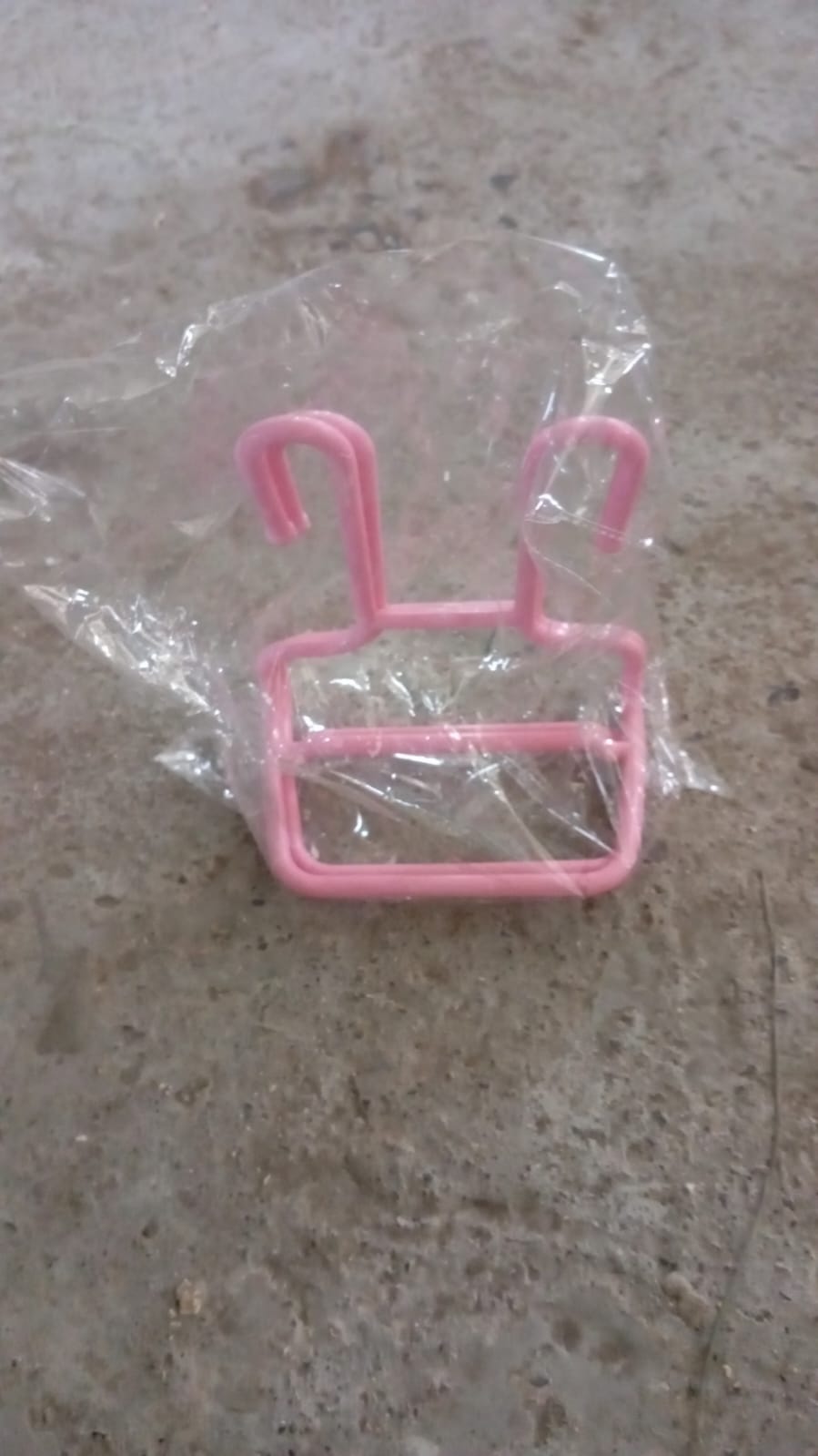 An empty plastic Shoe Drying Rack, highlighting its simple and effective hanging design.