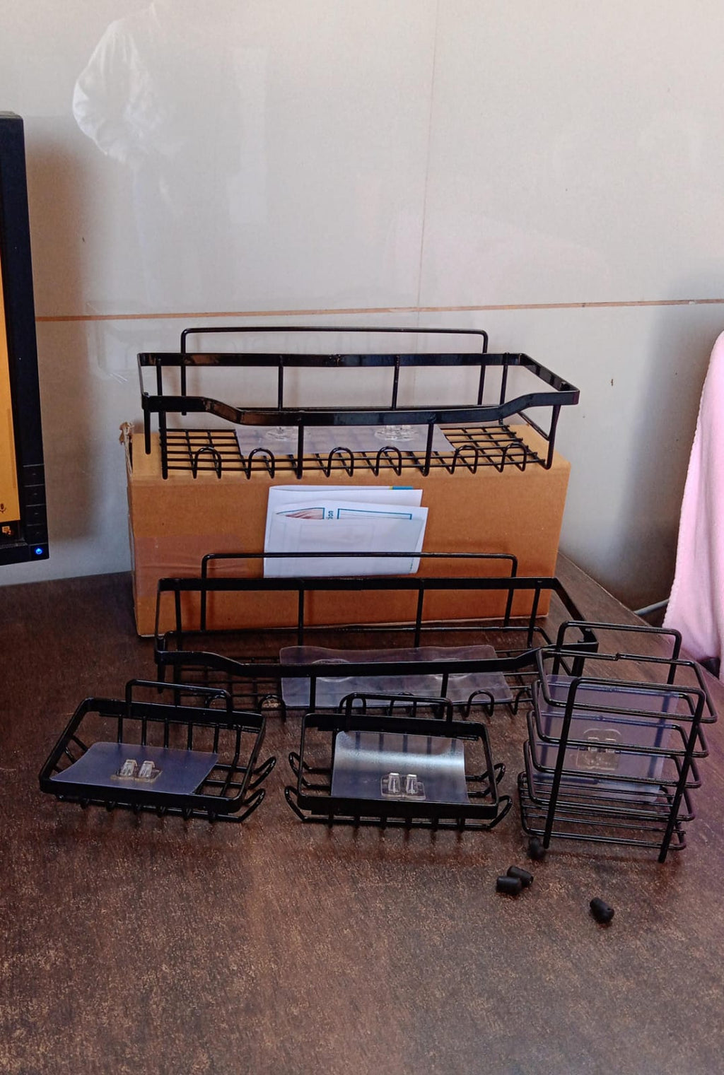 Compact metal bathroom caddy set providing space-saving shower storage solution