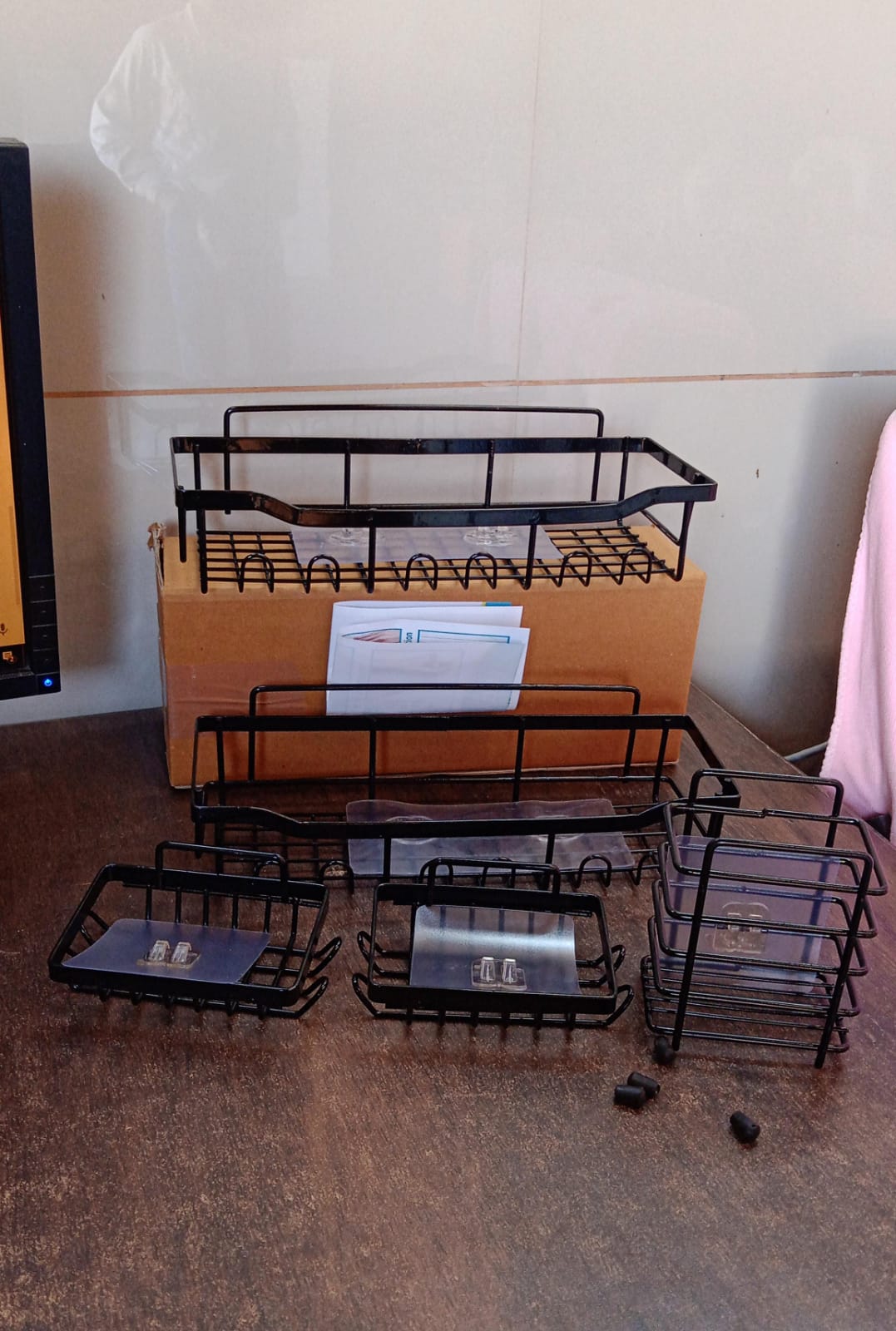 Compact metal bathroom caddy set providing space-saving shower storage solution