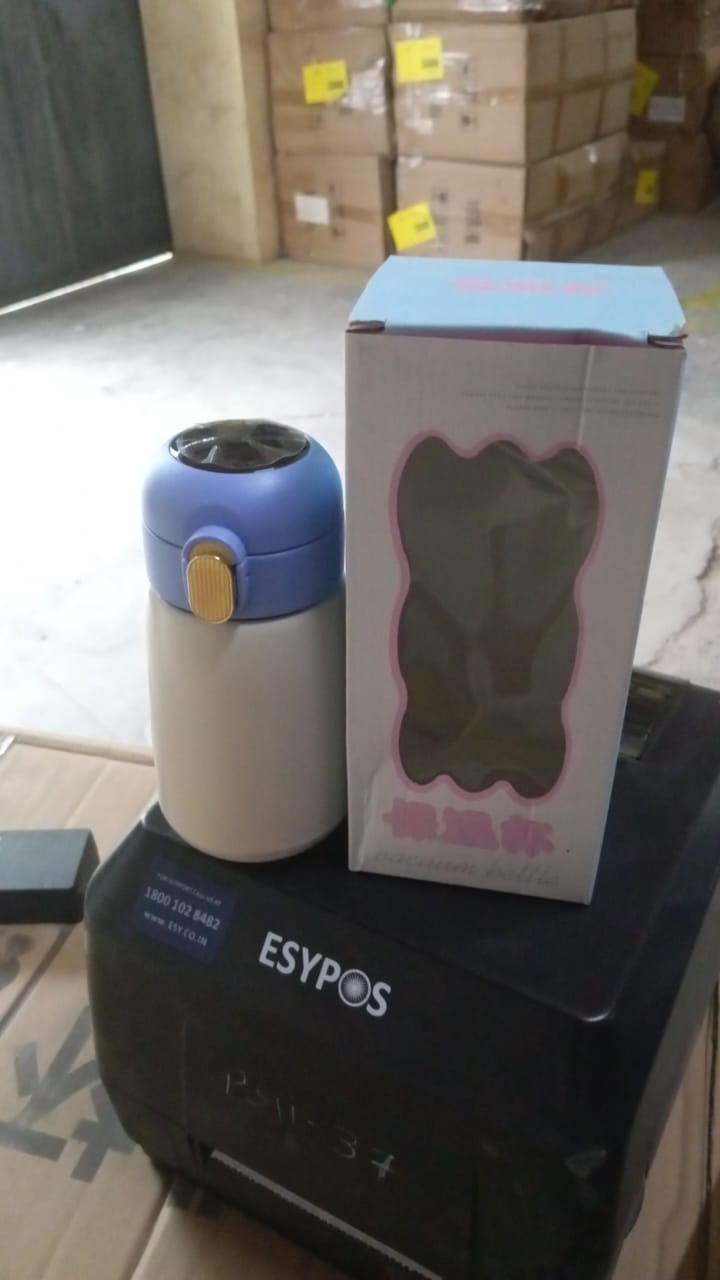 Detailed view of the smart water bottle's LED display and ergonomic design.