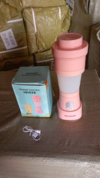 The foldable 500ml portable electric juicer, assembled and ready for travel.
