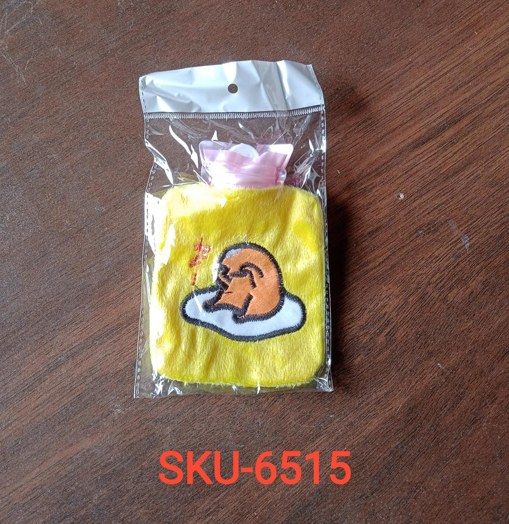 Angled view of the yellow duck hot water bag, highlighting its portable design.