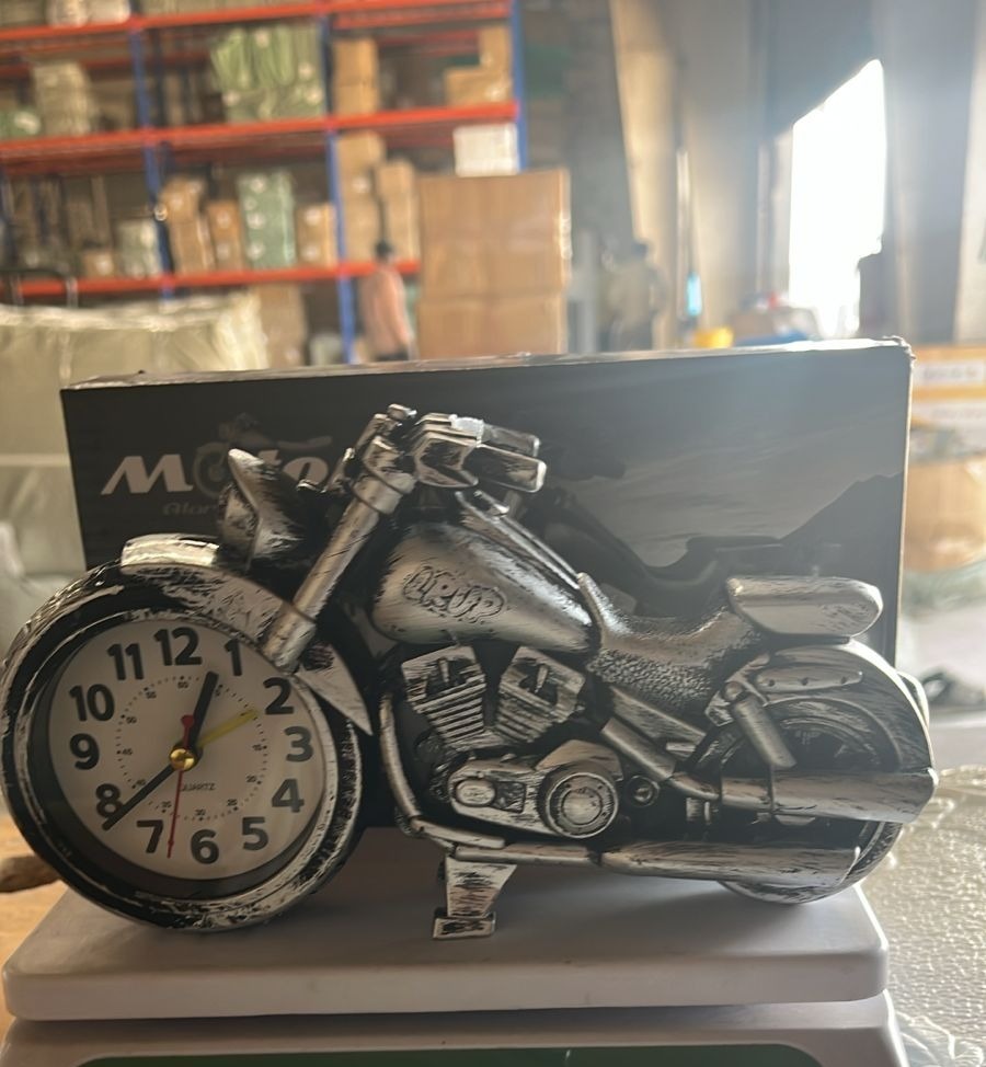 Motorcycle alarm clock lifestyle image on desk in home setting