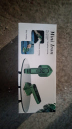 Alternative angle of the compact portable iron, showcasing its ergonomic design.