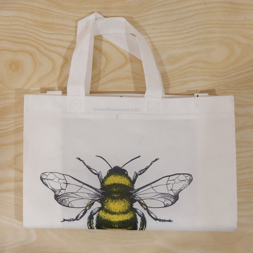 Top view of bee print tote bag showing material and design