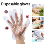 Bulk packaging of disposable clear gloves, showing multiple packs inside a larger box.