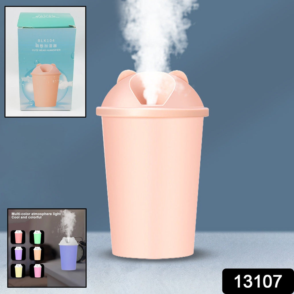 Portable mini humidifier operating in a cozy home setting, emitting a fine mist.