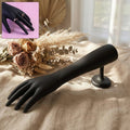 Black hand jewelry display stand with matte finish showing front view