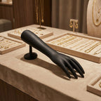 Side angle of black hand-shaped jewelry display stand in matte finish
