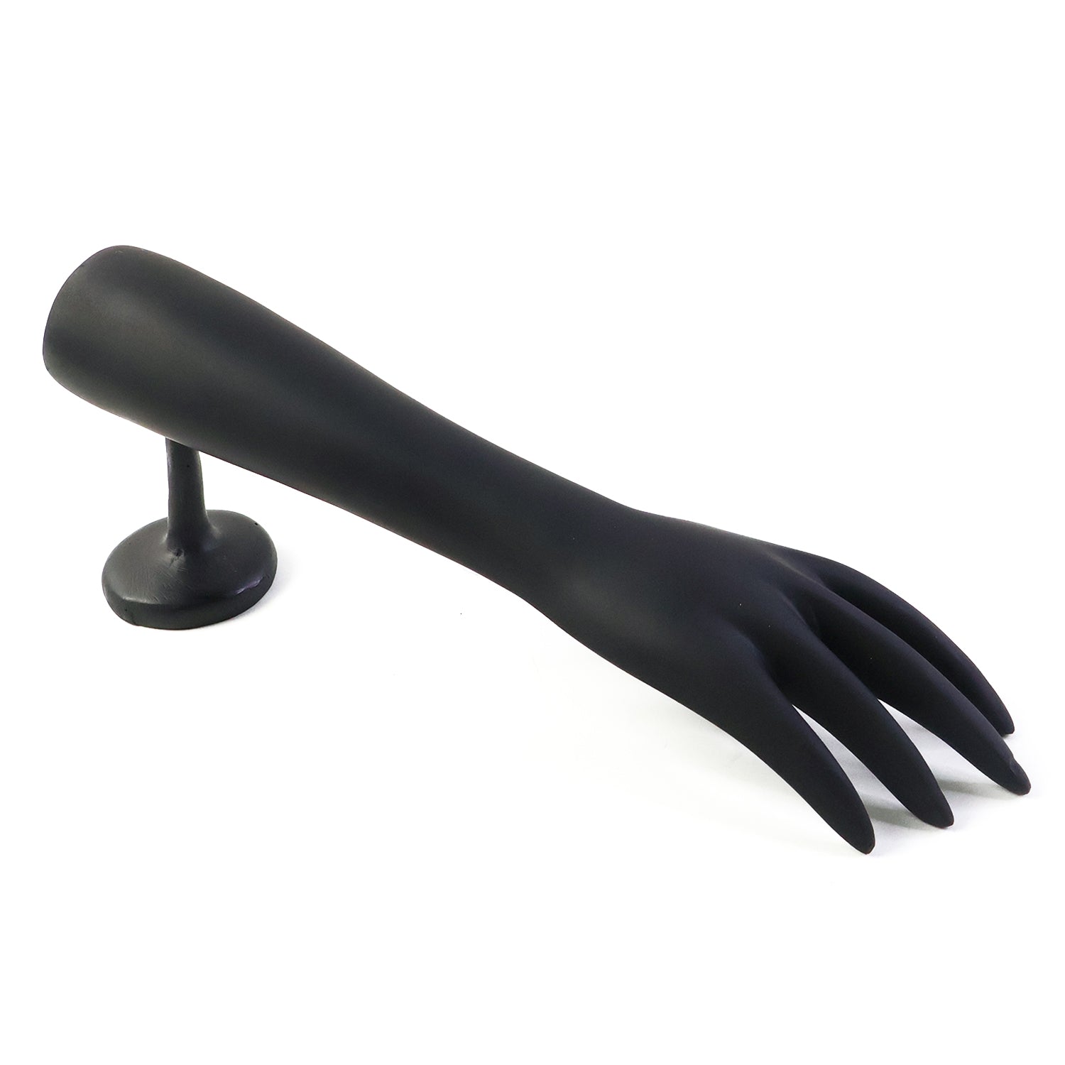 Jewelry pieces displayed elegantly on black hand-shaped stand