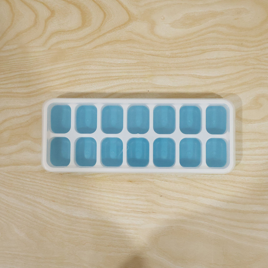 Blue ice cube tray in use for making ice cubes