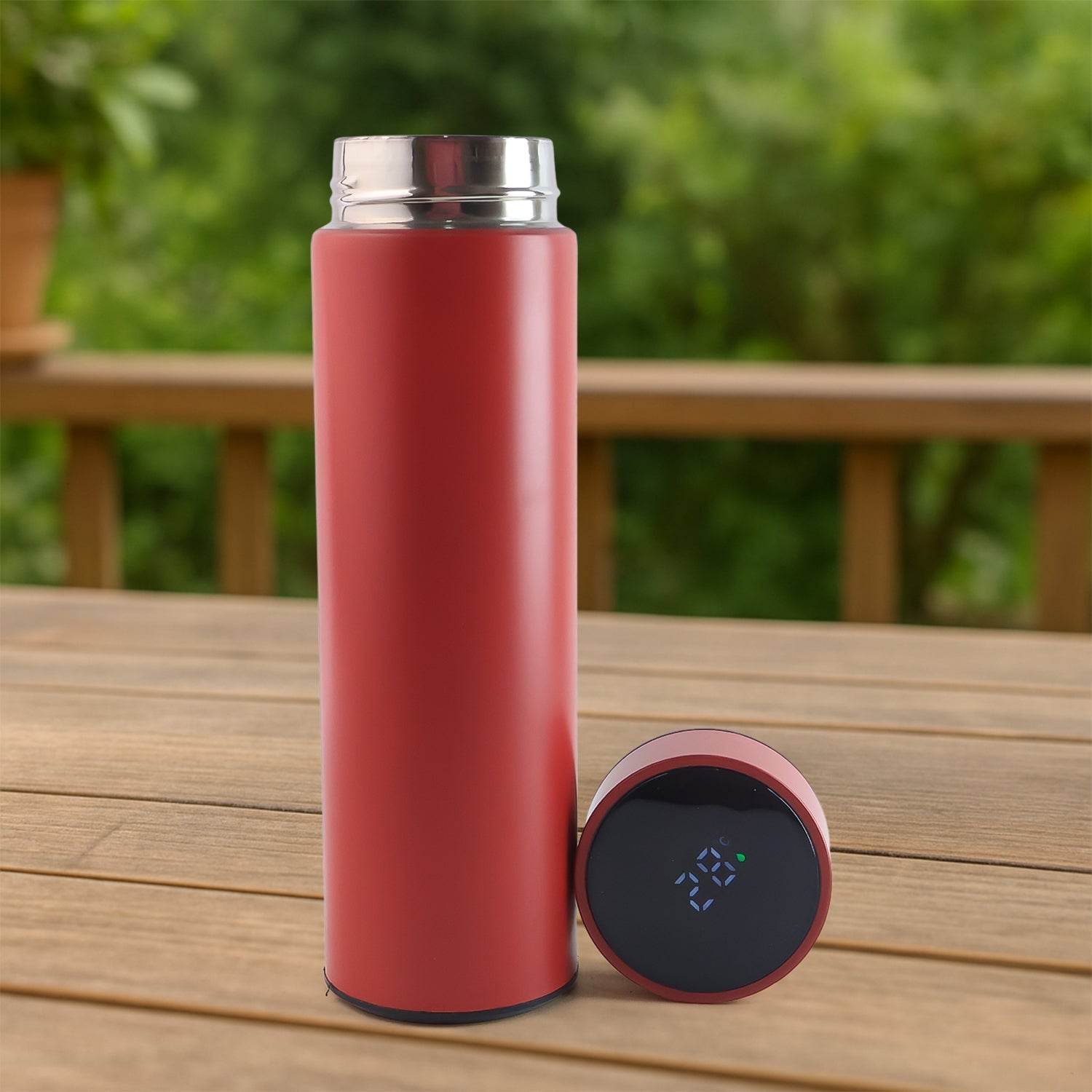 Red vacuum insulated water bottle with LED temperature display on top.