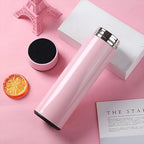 Sleek pink smart water bottle showing temperature on touch screen