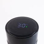 Side view of black vacuum insulated water bottle with LED screen