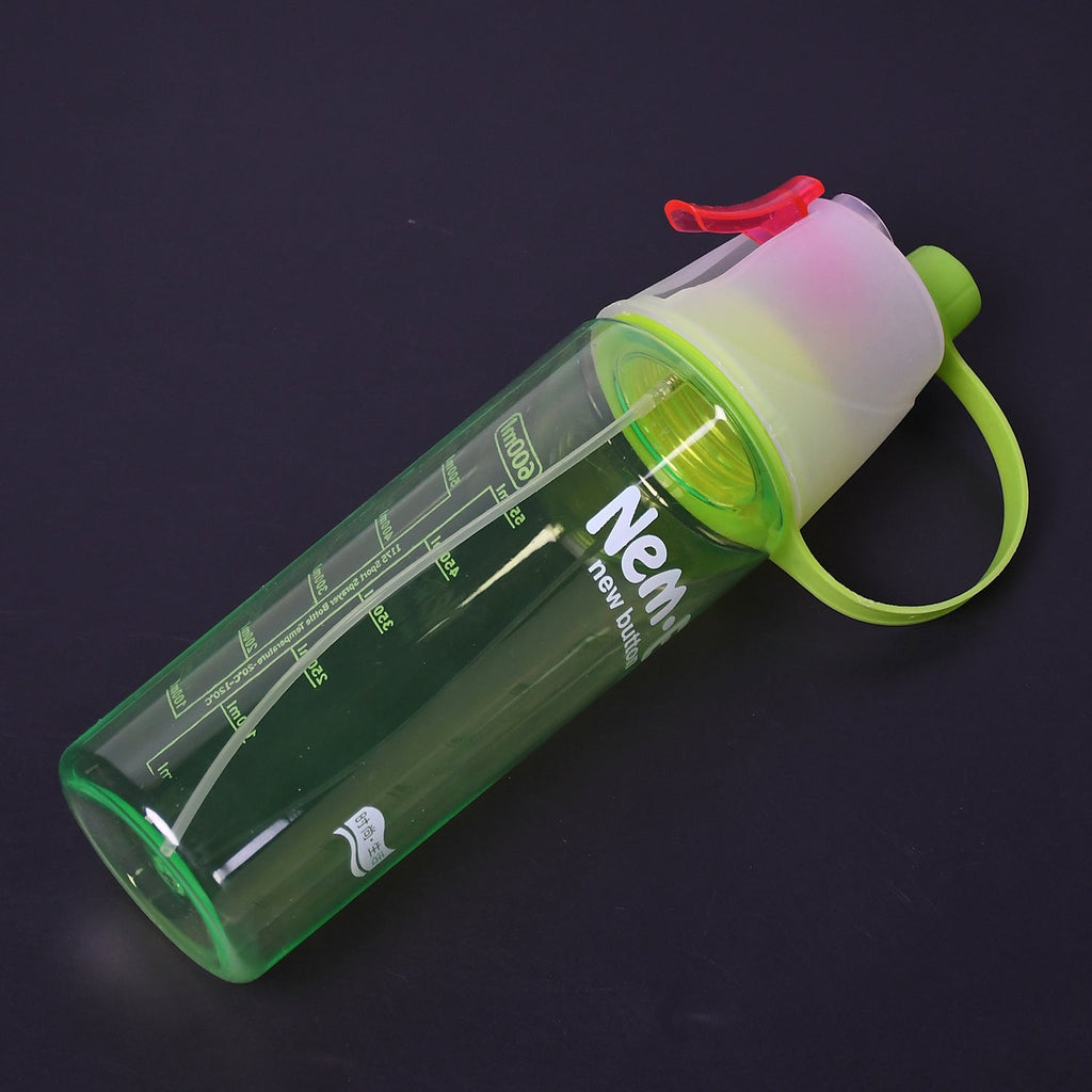 Athlete using the spray water bottle during a gym workout to stay refreshed and hydrated.