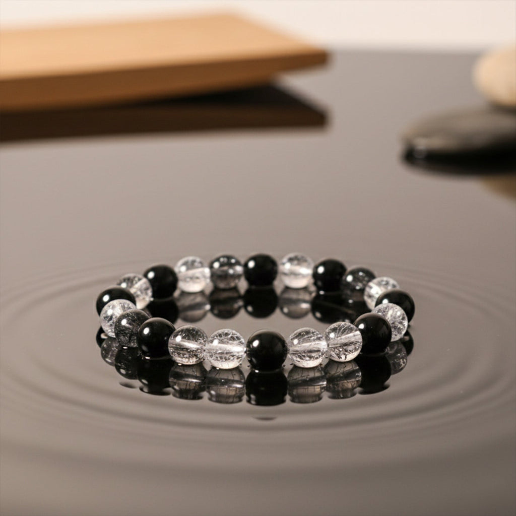 Dual-tone crystal stretch bracelet displaying glossy transparent beads