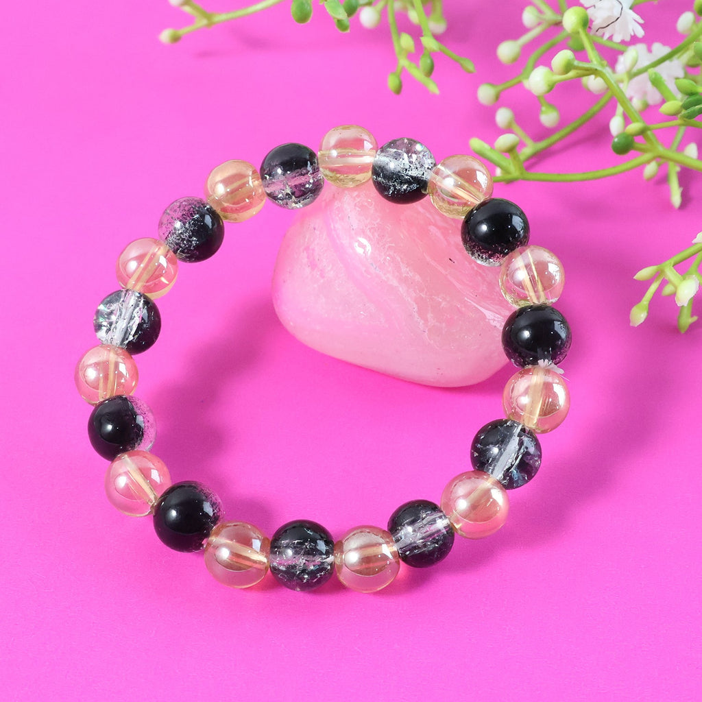 Various angles displaying bead textures of dual-tone crystal stretch bracelet