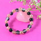 Various angles displaying bead textures of dual-tone crystal stretch bracelet
