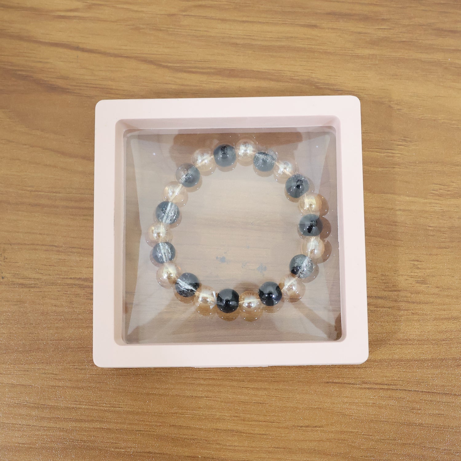 Lifestyle image of Dual-Tone Crystal Beaded Stretch Bracelet worn on wrist