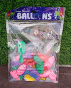 Hand holding vibrant multicolor latex balloons against a bright background.