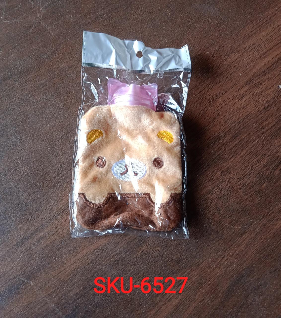 Detailed shot of the panda hot water bag's fabric cover and rubber bottle.