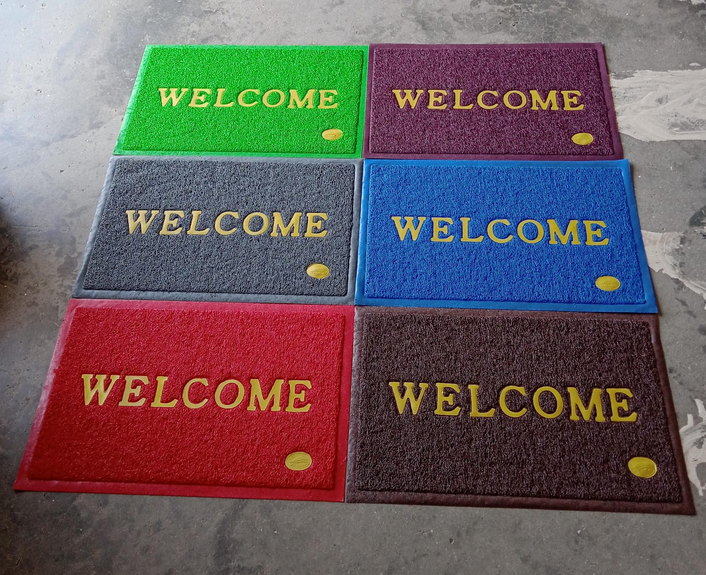 An overhead shot of the Welcome Door Mat in a clean, minimalist home setting.