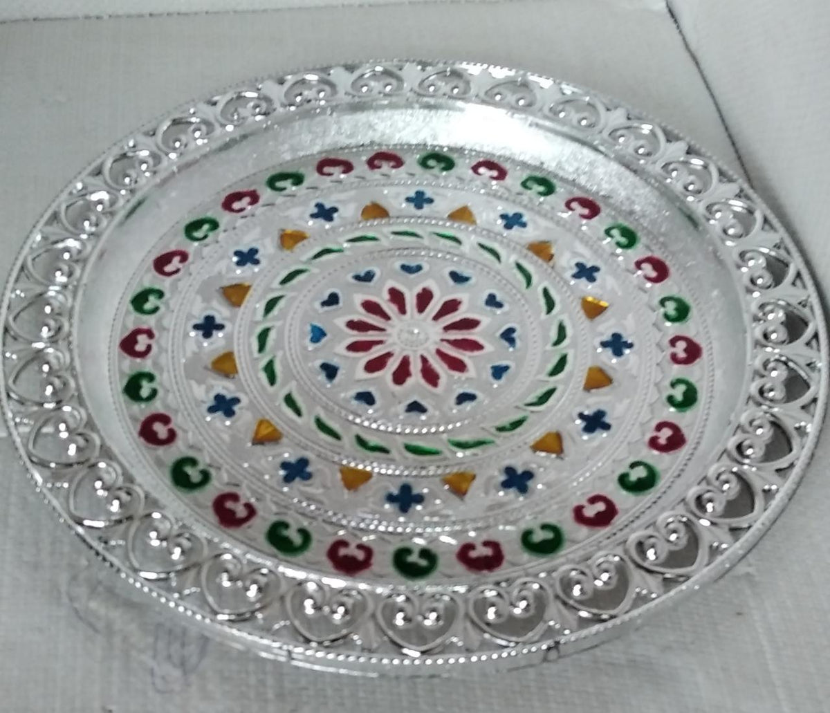 Elegant silver plated pooja thali, perfect for Indian traditional worship and ceremonies.
