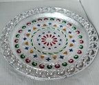 Elegant silver plated pooja thali, perfect for Indian traditional worship and ceremonies.