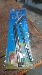 Hand holding a glass with an eco-friendly bent stainless steel straw, promoting sustainable living in India.