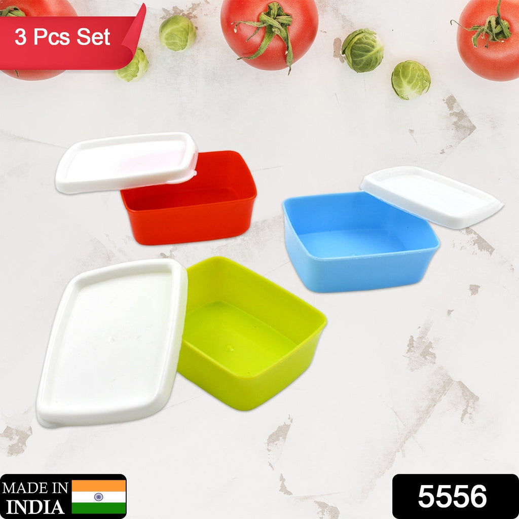Airtight plastic storage containers filled with fresh food on a kitchen counter.