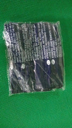 Comparison shot showing the compact size of the deflated velvet travel pillow.