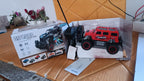 Mist Spray Race Car Toy navigating an off-road rocky surface, emitting smoke.