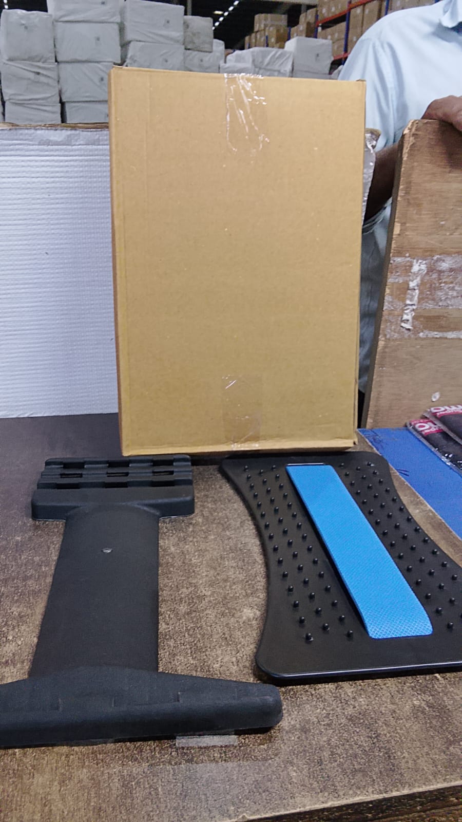 Multi-level back stretcher posture corrector device neatly packaged, ready for secure shipping.