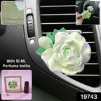 Close-up of elegant rose flower air freshener clip for car AC vent