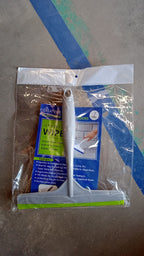 Versatile kitchen wiper being used to clean a car windshield.