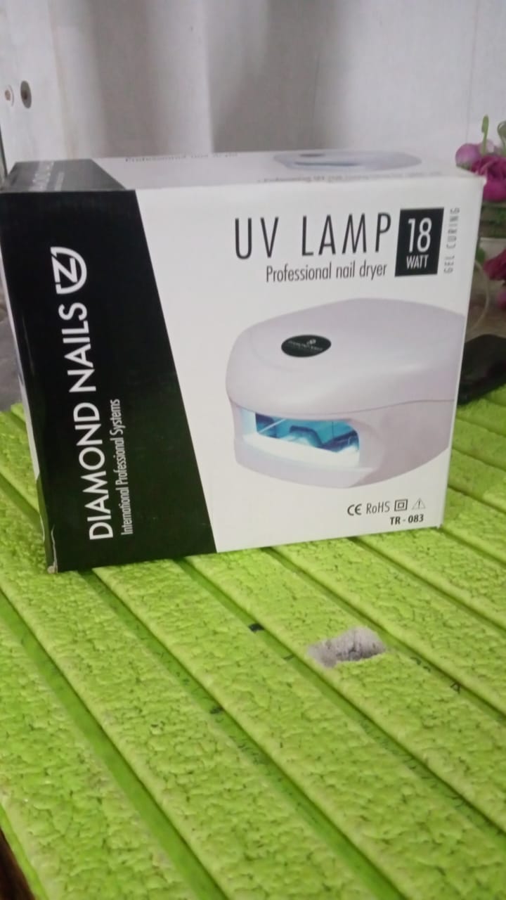 Packaging for the AuriGlam 18W LED UV Nail Lamp, showing product branding.