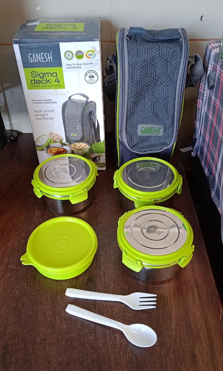 Ganesh Stainless Steel Tiffin Lunch Box fitting perfectly inside a modern lunch bag.
