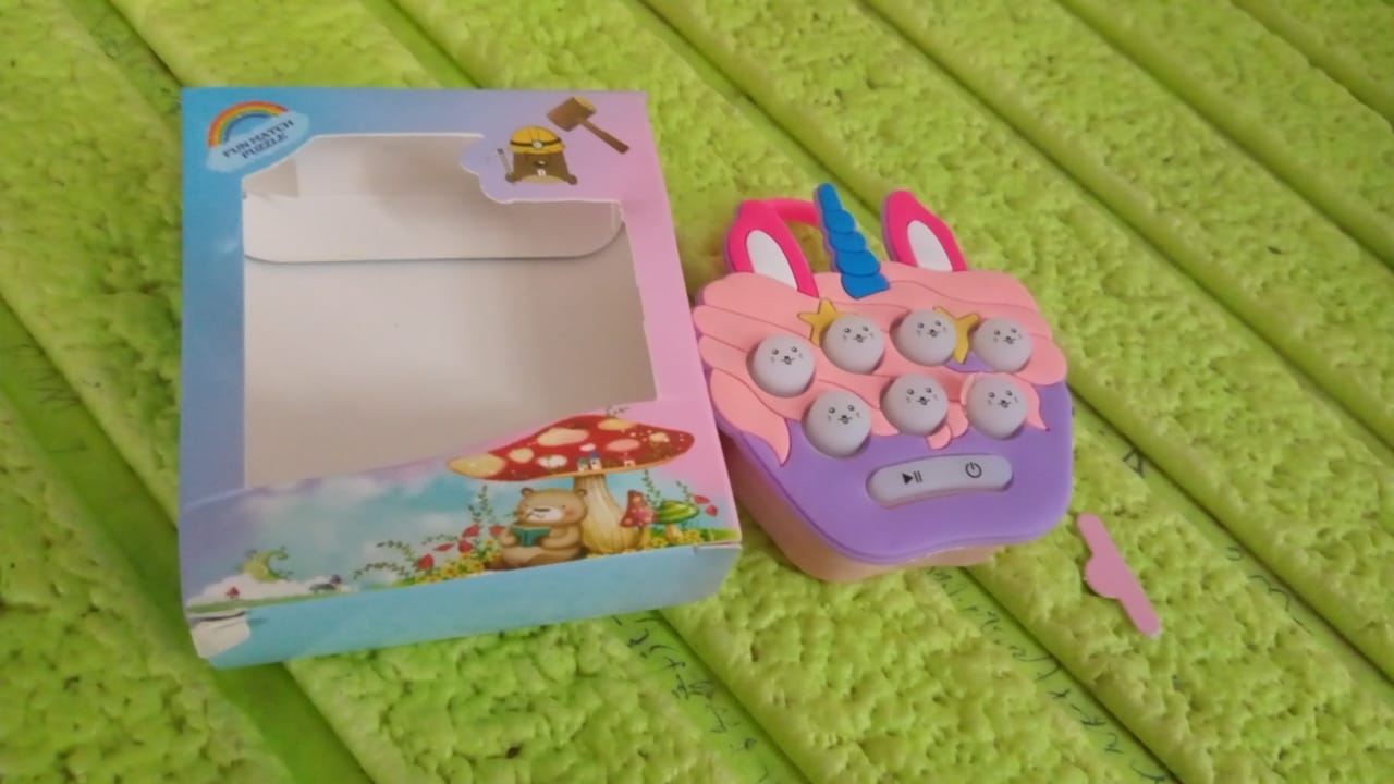Side view of the interactive Mini Push Bubbles Game for kids.