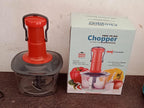 Quickslice manual food chopper ready for use, highlighting its robust stainless steel blades.