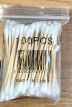 Eco-friendly cotton swabs packaging highlighting biodegradable wooden stems
